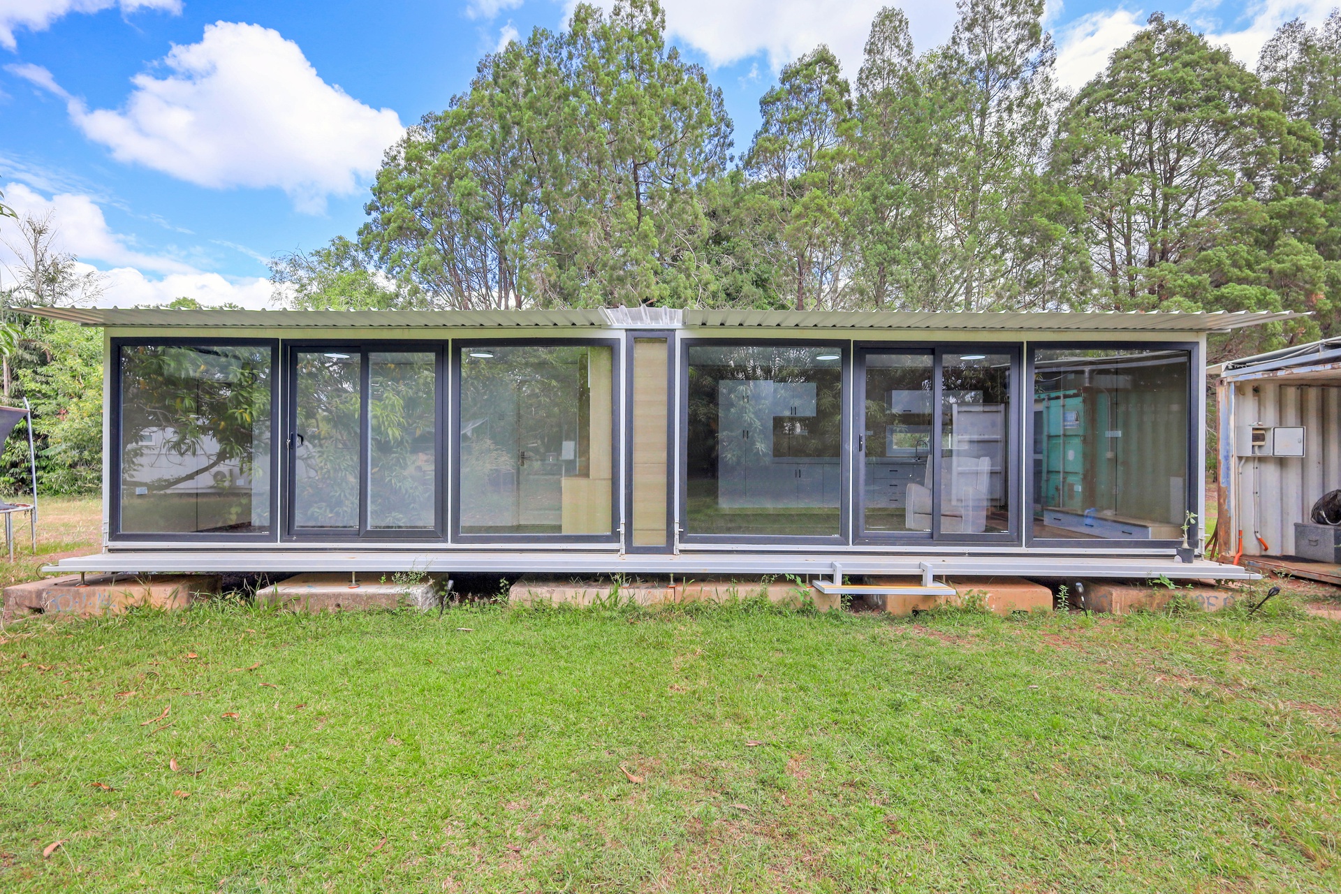 40ft Containerised Slide Out Home - With Infinity Glass Frontage
